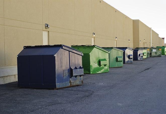 big yellow dumpsters on a construction lot in Burlingame, CA